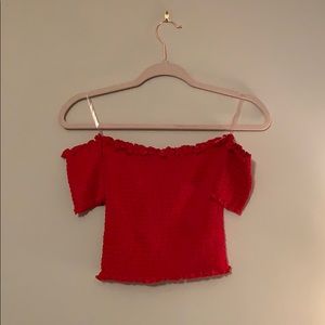 red cropped off the shoulder shirt
